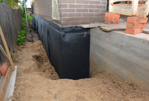 Happy homeowners after waterproofing job in Lake George